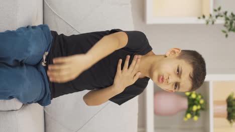 Vertical-video-of-Boy-with-chest-pain-is-suffering.